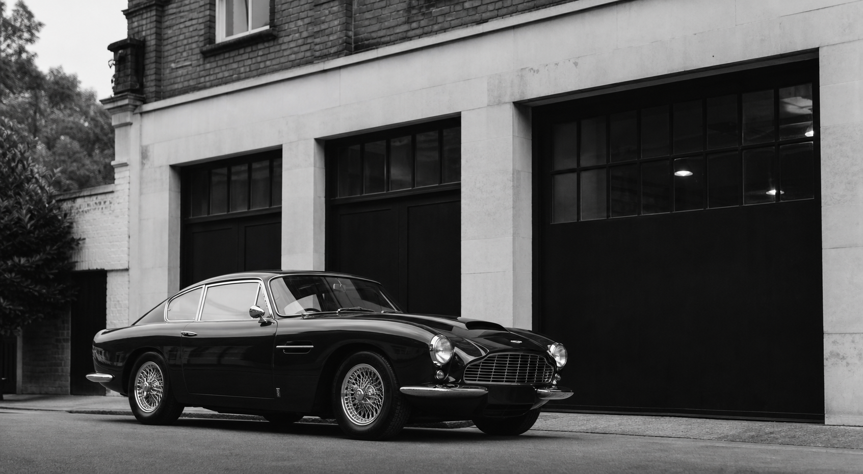 Monochrome vehicle on a quiet London street.