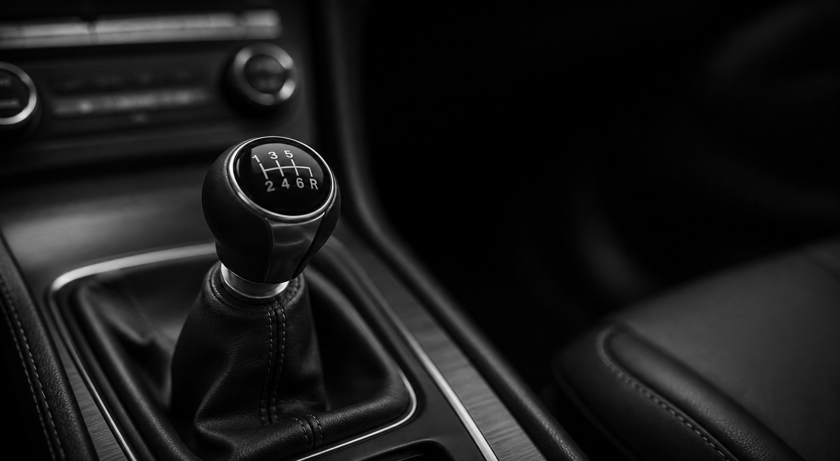 Monochrome close-up of an unbranded manual gear selector.